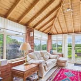 A conservatory with relaxing views across the garden to open countryside beyond.