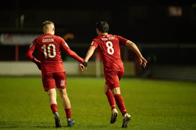 Scorer Alex Purver is congratulated by teammate Harry Green. Photo by Wandering Photography