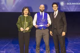 Coastliner bus driver Mariusz Losinski (centre) with his Gold award as Top National Bus Driver. BBC News presenter Jane Hill (left) presented the awards in a glittering ceremony in London, with Robert Jack (right) Managing Editor of award sponsor Passenger Transport.