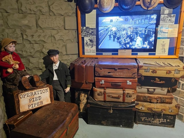 Evacuees wait for a train