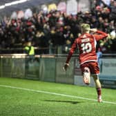 Harry Green races away to celebrate his superb second goal with the Boro crowd.