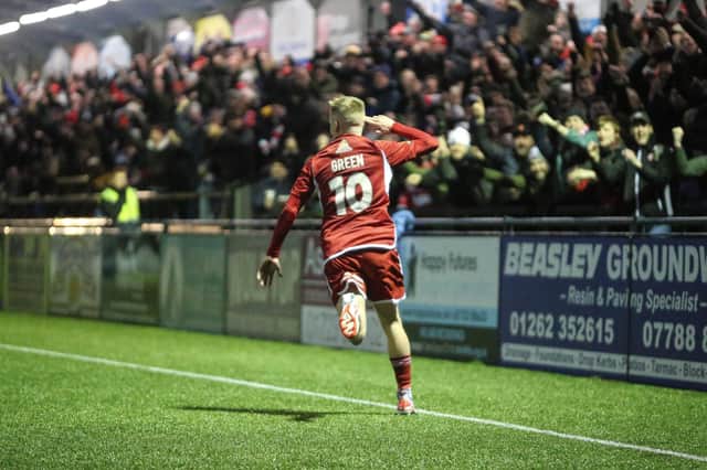 Harry Green races away to celebrate his superb second goal with the Boro crowd.
