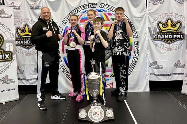 Typhon Head Coach Pete Dicks lines up with the quartet who were among the medals at the WKO European Championship.