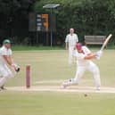 Pocklington's Joel Taylor smashes his side's total beyond 300.as they won by 213 runs at home to Hornsea. PHOTO BY PHIL GILBANK