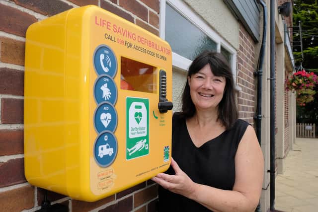 Joanne Hakings with the new defibrillator