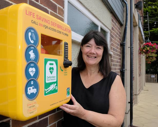 Joanne Hakings with the new defibrillator