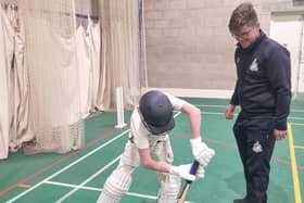 Alfred Denton gets batting coaching from Archie Hammond