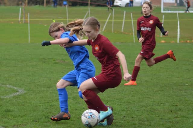 Erin Hirst in action for Scarborough Ladies FC U12s Reds in their 2-1 win against Heslerton