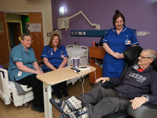 Patient Steve Kenny chats to staff in his room