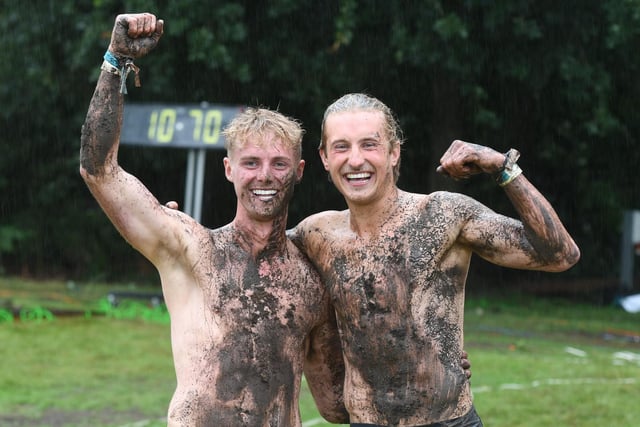 Expert winner Ched Adamski and Novice winner Shaun Spozio covered in mud after winning the Pole Climbing Championships at the show
