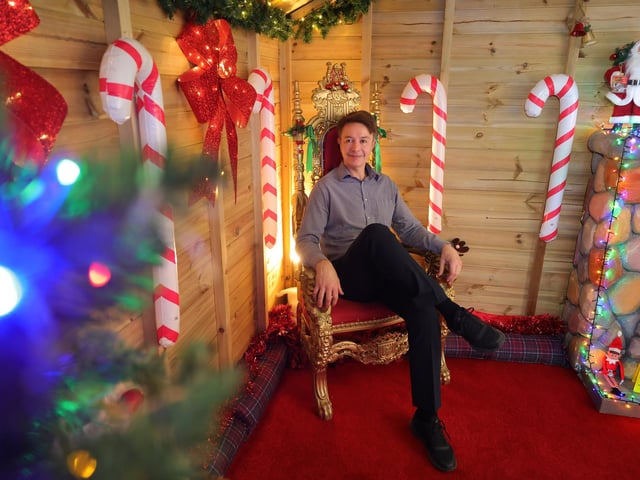 Chris Golder takes a break in Santa's chair.