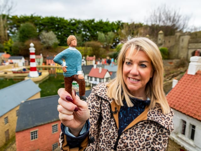 Rachel Hill, Owner of Bondville Model Village in Bridlington, holding one of the repainted figures to be placed back into the model village