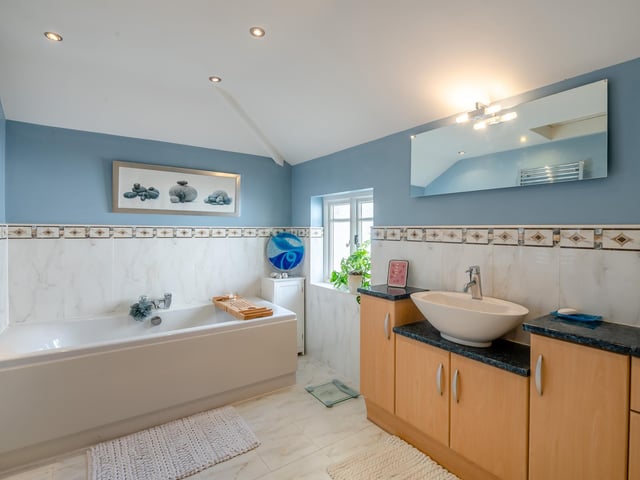 One of three bathrooms in the property.
