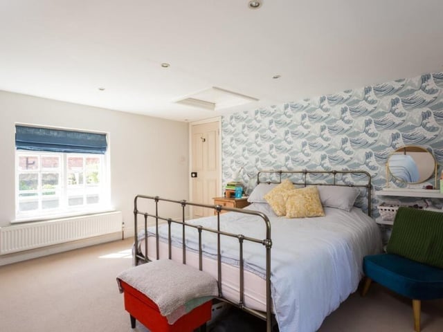 A spacious double room with spotlights to the ceiling.