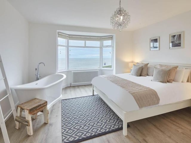 A double, sea-front bedroom with free-standing bath.