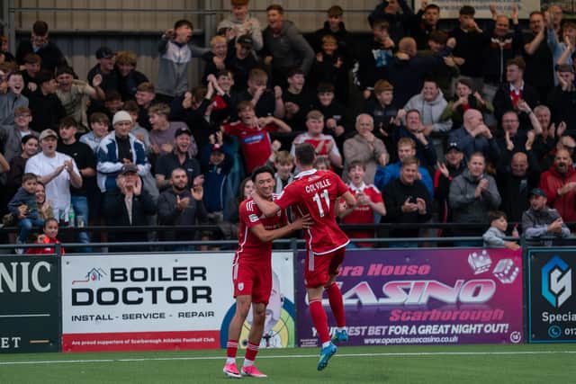 Two-goal hero Rio Allan celebrates with teammate Luca Colville in front of a jubilant home crowd. Photo by Wandering Photography