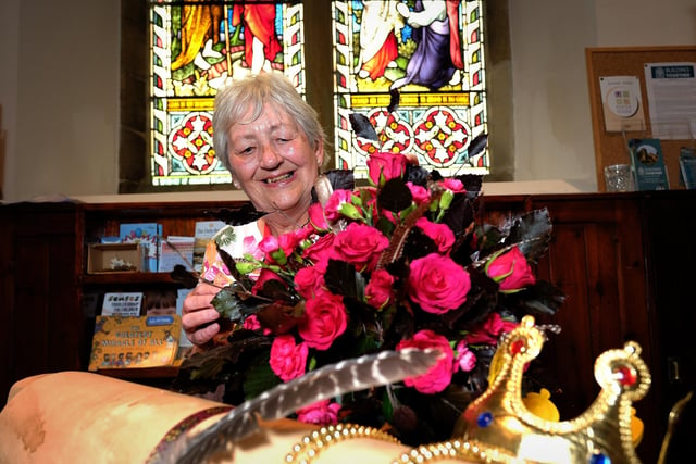 St. Laurence's Church had its annual flower festival and volunteer Maureen Frost shows off one of the displays.