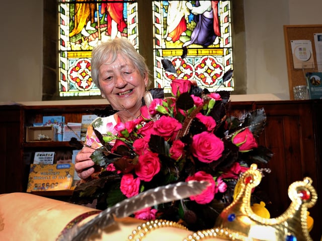 St. Laurence's Church had its annual flower festival and volunteer Maureen Frost shows off one of the displays.