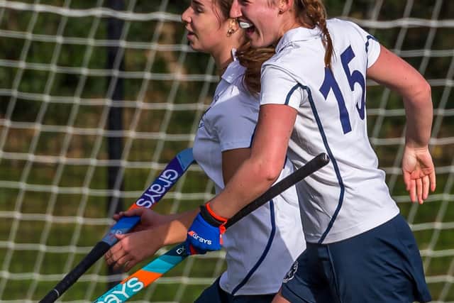 Tasha Kent (15) celebrates with scorer of the fourth goal, Anna Willison