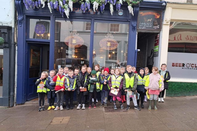 Airy Hill School youngsters outside Sherlocks as part of their World Book Week activities.