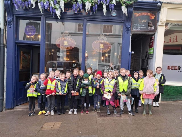 Airy Hill School youngsters outside Sherlocks as part of their World Book Week activities.