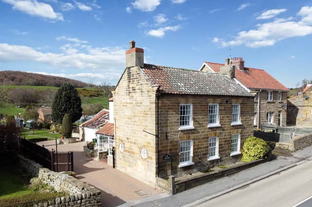 The village property has a lovely location with open countryside to the rear.