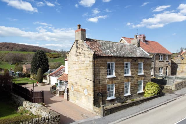 The village property has a lovely location with open countryside to the rear.