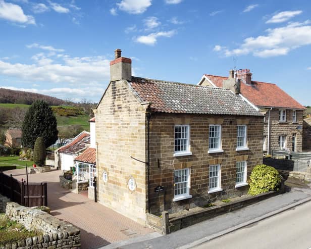 The village property has a lovely location with open countryside to the rear.