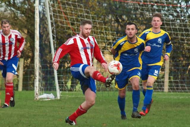 Hunmanby United get on the ball during their 4-2 defeat against derby rivals Filey Town. Picture: Steve Lilly.