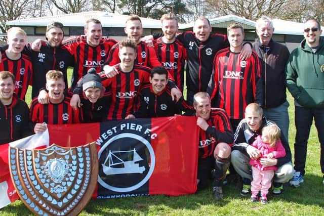 West Pier show off their league shield from last season
