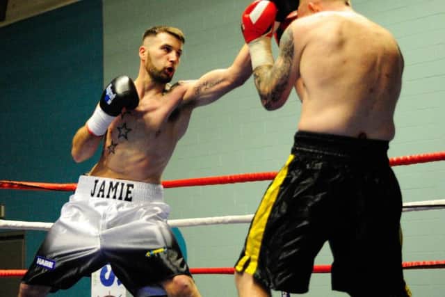 Jamie Scotter whips home a left hand to the head of Richard Harrison. Picture: Andy Standing