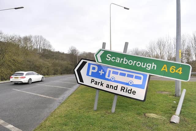 Damaged road sign on Musham Bank roundabout, Scarborough.