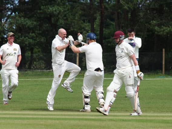 Paul Kinghorn celebrates claiming a wicket for Heslerton in their defeat at home to Seamer