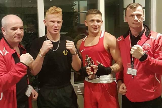 Coaches John Brownlie (left) and Kamil Sawicki (right), with boxers Kieron Brown and Tom Jenkinson
