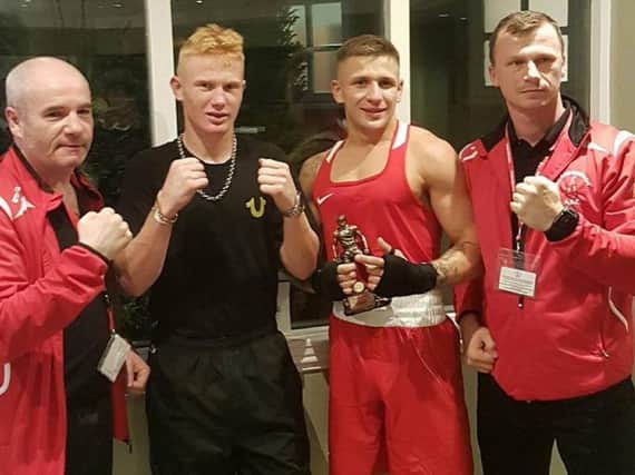 Coaches John Brownlie (left) and Kamil Sawicki (right), with boxers Kieron Brown and Tom Jenkinson
