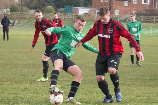 Sleights' Charlie Paterson is pressed by Will Jenkinson of West Pier. Pictures by Steve Lilly.