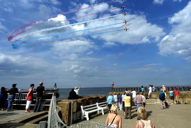 The Red Arrows fly over Whitby.
