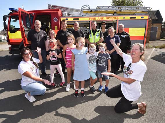Organisers ,Scarborough fire service and Police representatives and kids enjoy the afternoon.