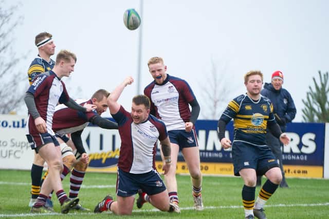 Sam Dawson celebrates his try