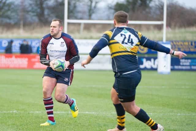 Tom Ratcliffe prepares to offload to a teammate