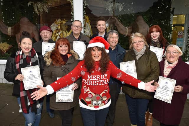 Janet Jefferson presents the Christmas Business window competition winners. Cloe Smith, Dave Binns, Amy Crowther, Phil Cook, Chris Golder, Tony Stevens, April Fletcher, Meg Watts and Elaine Truman. Picture: Richard Ponter