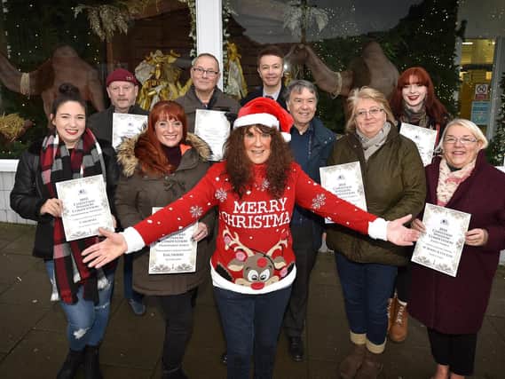 Janet Jefferson presents the Christmas Business window competition winners. Cloe Smith, Dave Binns, Amy Crowther, Phil Cook, Chris Golder, Tony Stevens, April Fletcher, Meg Watts and Elaine Truman. Picture: Richard Ponter