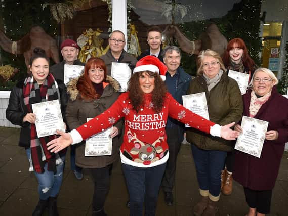 Janet Jefferson presents the Christmas Business window competition winners. Cloe Smith, Dave Binns, Amy Crowther, Phil Cook, Chris Golder, Tony Stevens, April Fletcher, Meg Watts and Elaine Truman.  Picture: Richard Ponter