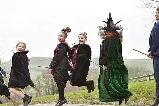 Fyling Hall youngsters try these broomsticks out for size.