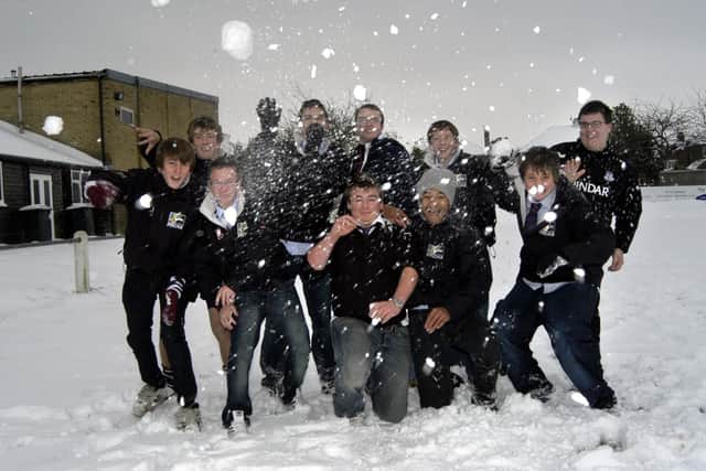 Scarborough Rugby Club's U17s from 2008, who were unable to play their game because of the snow, take it out on the Scarborough News photographer.