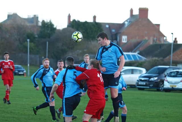 A Filey Town man wins a header