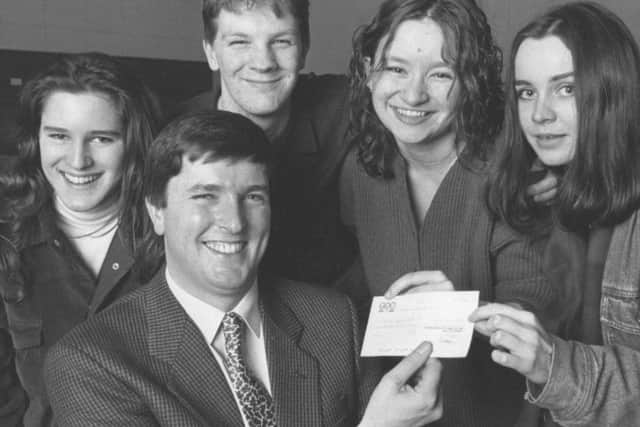 Terence Higgins Trust speaker Max Potter, front, received a 300 cheque from four members of the Sixth Form College Charities Committee Group in 1993 - from left, Cheryl Binnis, Martin Bradnam, Eliza Carthy and Liz Williams.