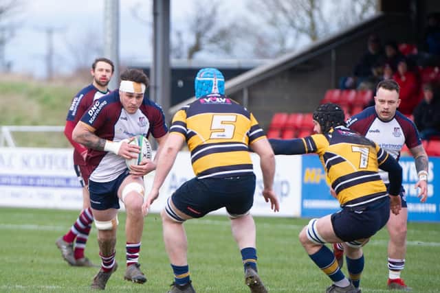 Cade Robinson tries to plough his way through the West Leeds line