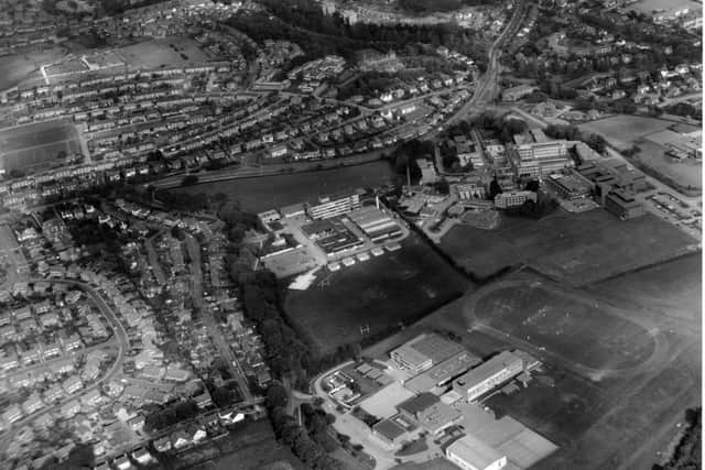 Quite tricky, due to the unusual perspective. Until it merged, what was the name of the school at the bottom of the photo ?