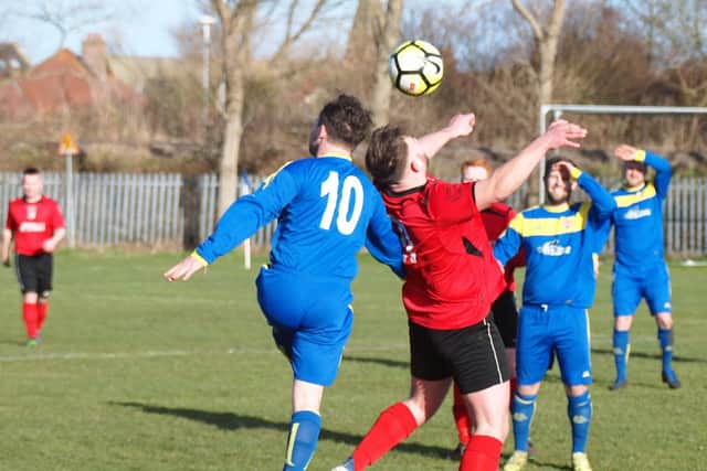 Filey's Max Gage tries to hold the ball up